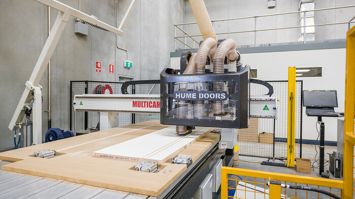 Compressed air being used to power a CNC routing machine at Hume Doors.