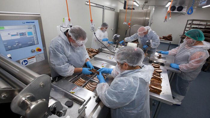 Processing the smoked meat at Texas BBQ Foods