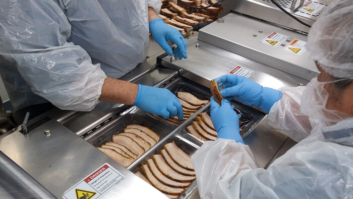 Packing the smoked meat at Texas BBQ Foods